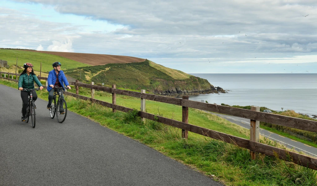 Couple cycling through Dungarvan, Waterford Greeenway Irelands Ancient East Ireland