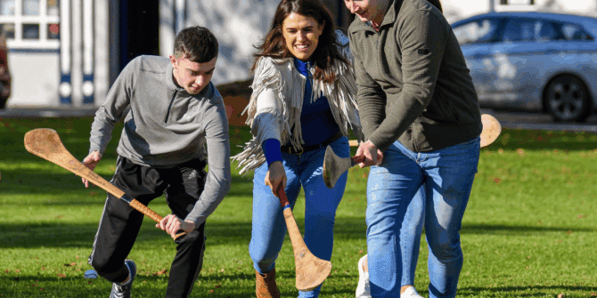 Couple learning how to play hurling - ANCIENT EAST